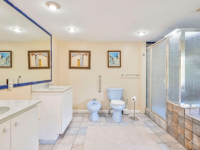 bathroom with a bidet, toilet, a stall shower, and vanity