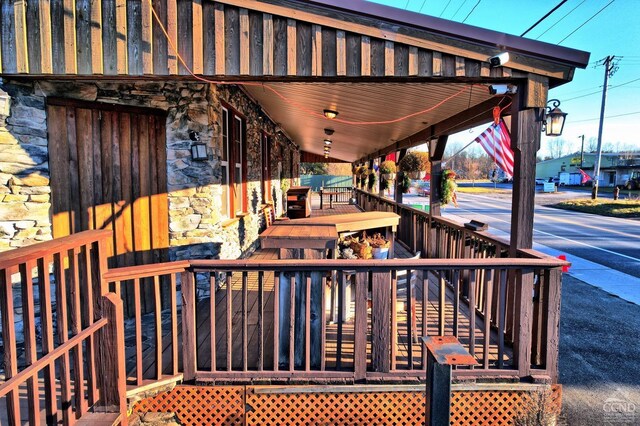 wooden terrace featuring covered porch