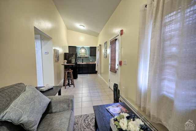 living room featuring light tile patterned floors and lofted ceiling