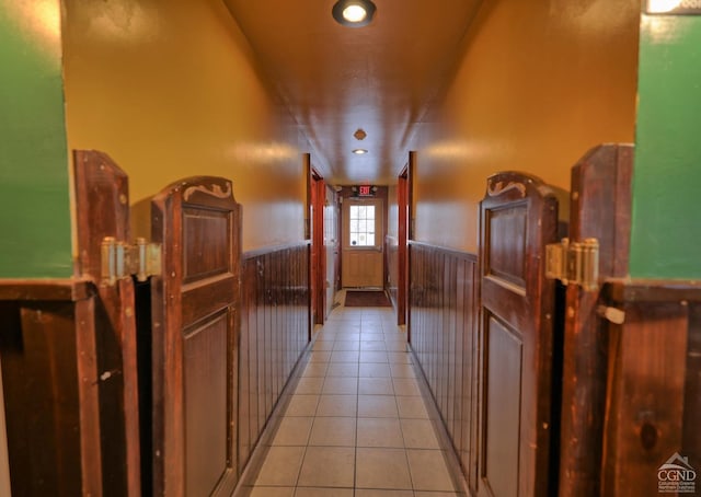 corridor featuring light tile patterned floors