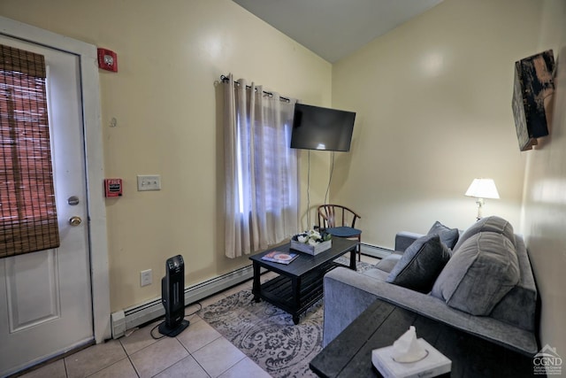 living room featuring light tile patterned floors, a wealth of natural light, and a baseboard heating unit