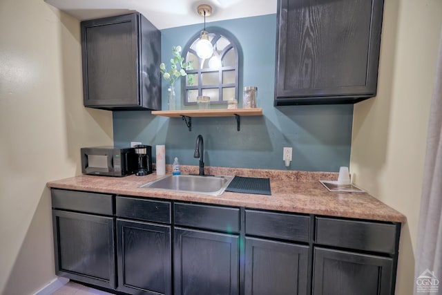 kitchen with sink and decorative light fixtures