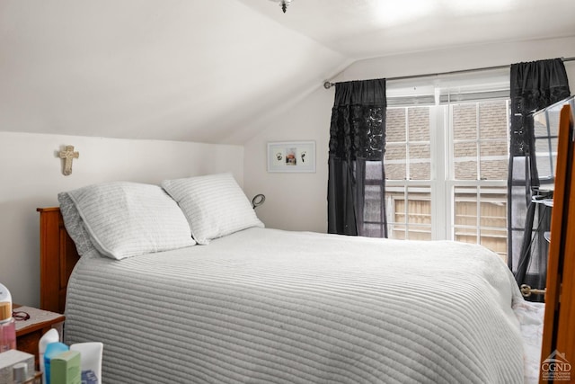bedroom featuring lofted ceiling