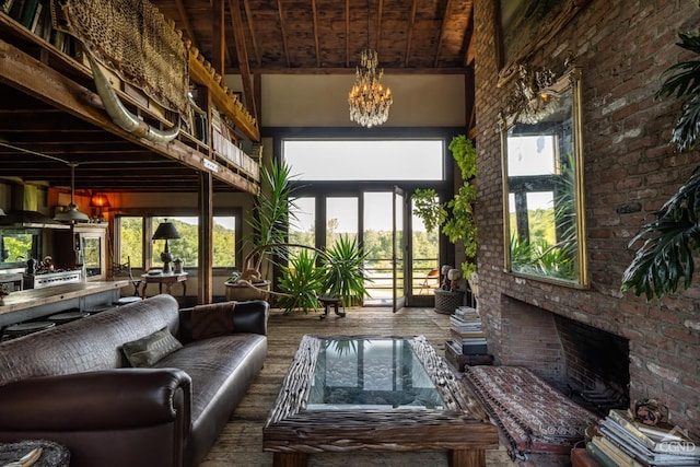 interior space with wooden ceiling, french doors, an inviting chandelier, lofted ceiling with beams, and a fireplace