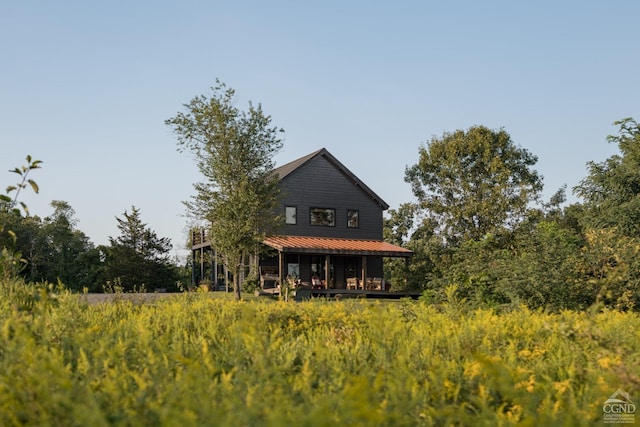 back of house with a porch