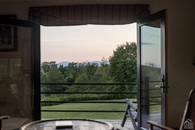 view of balcony at dusk