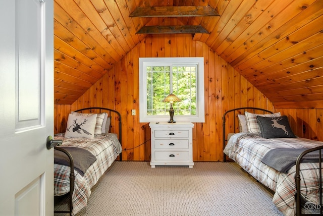 carpeted bedroom with wooden walls, lofted ceiling with beams, and wooden ceiling