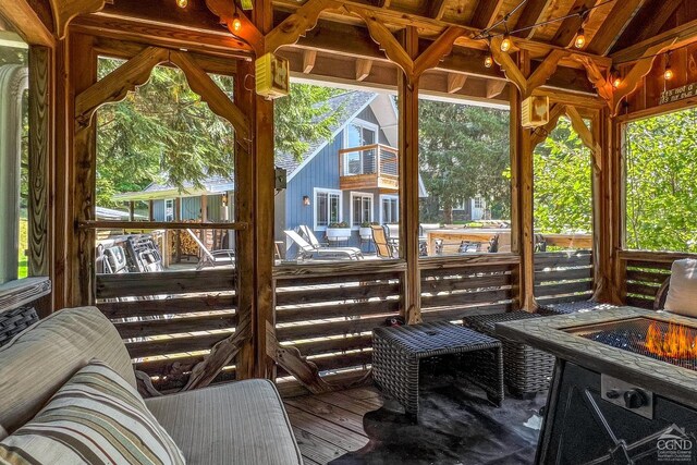 sunroom / solarium with lofted ceiling