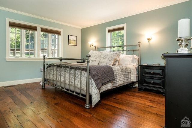 bedroom featuring dark hardwood / wood-style flooring and ornamental molding