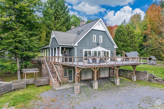 back of property featuring a wooden deck