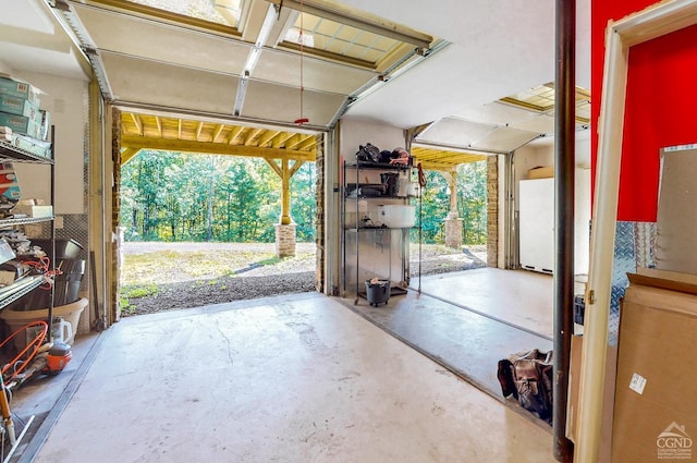 garage featuring white fridge