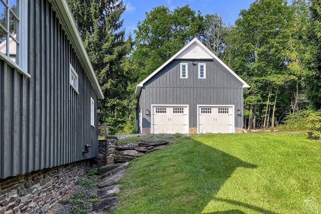 garage featuring a yard