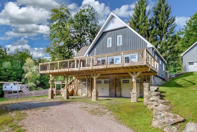 view of front of home with a front yard and a wooden deck