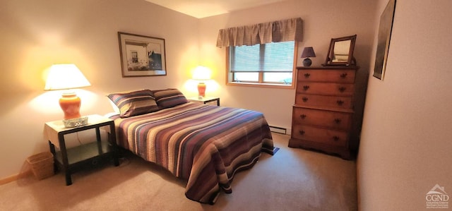 carpeted bedroom featuring a baseboard heating unit