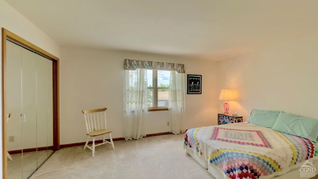 bedroom with light carpet and a closet