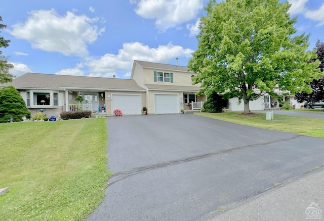 view of front of home featuring a garage and a front lawn