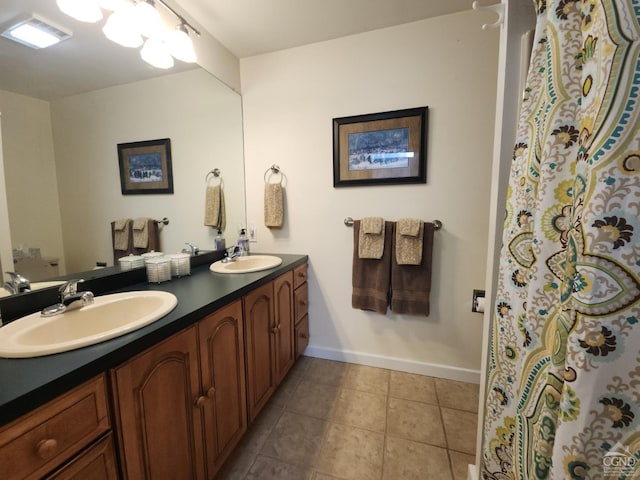 bathroom with tile patterned floors and vanity