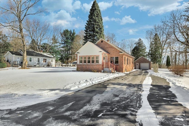 view of front of house featuring an outbuilding and a garage