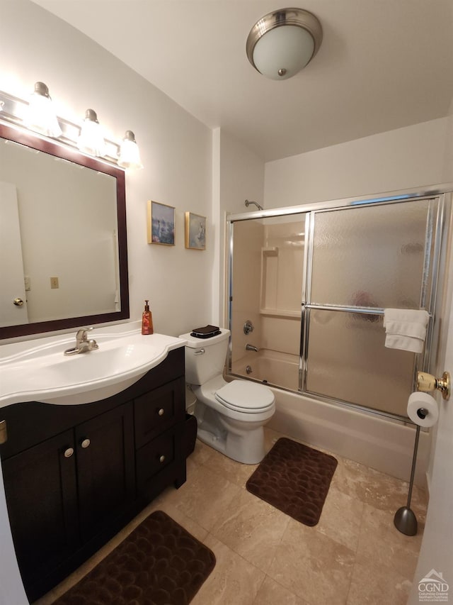 full bathroom with toilet, vanity, and combined bath / shower with glass door