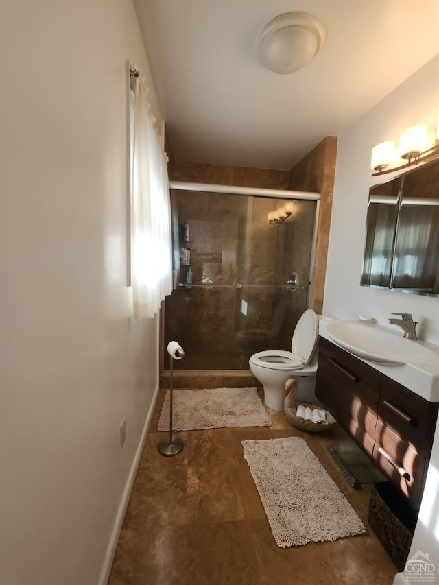 bathroom featuring vanity, toilet, and walk in shower