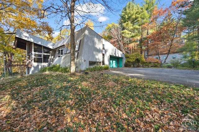 view of side of home with a garage