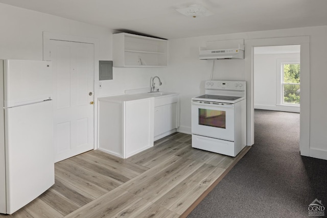 kitchen with white appliances, sink, light wood-type flooring, white cabinetry, and extractor fan