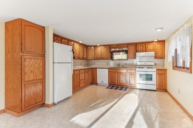 kitchen with sink and white appliances