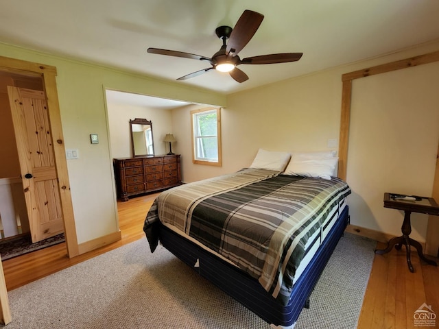 bedroom featuring light hardwood / wood-style flooring and ceiling fan