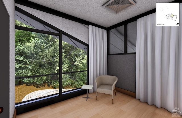 sitting room featuring hardwood / wood-style flooring and a wealth of natural light