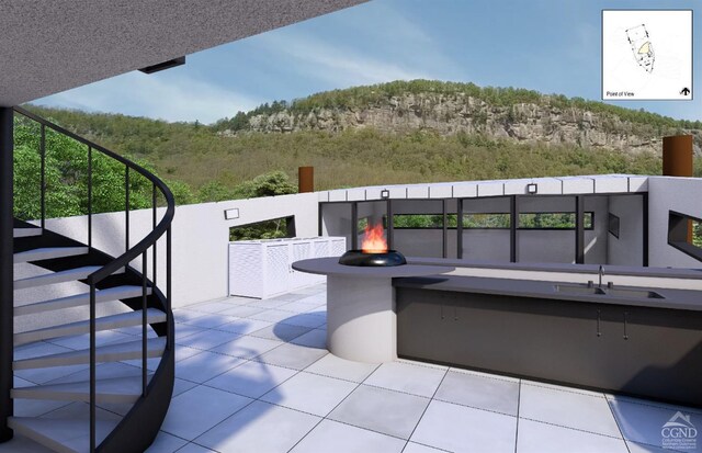 view of patio / terrace with sink and an outdoor fire pit