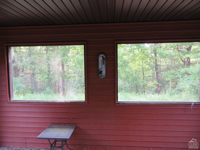 interior details featuring wood walls and wooden ceiling