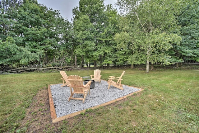 view of yard with an outdoor fire pit