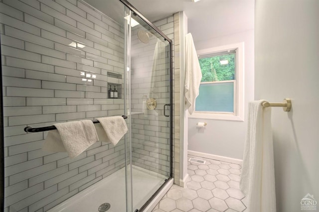 bathroom featuring tile patterned flooring and walk in shower