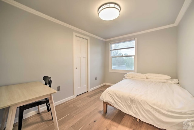 bedroom featuring crown molding and hardwood / wood-style floors