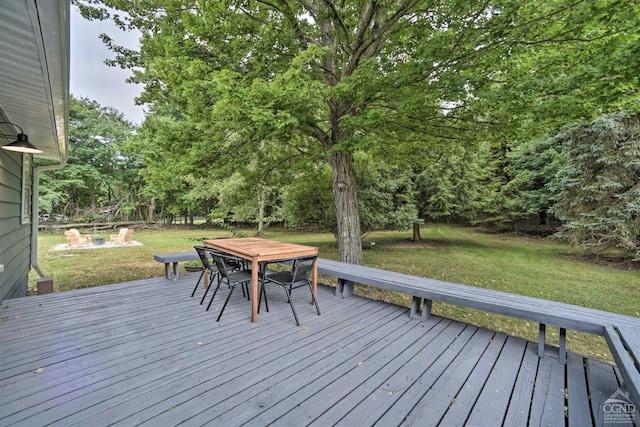 wooden deck featuring a yard