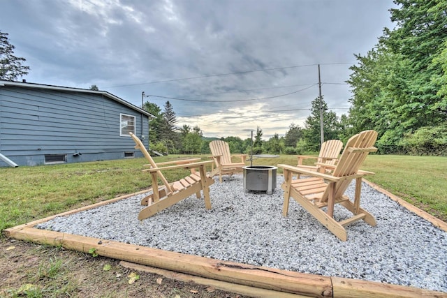 view of yard with an outdoor fire pit