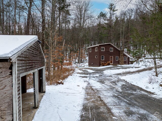 yard layered in snow with a garage