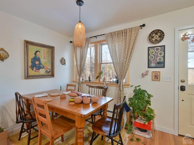 dining area featuring light wood-type flooring