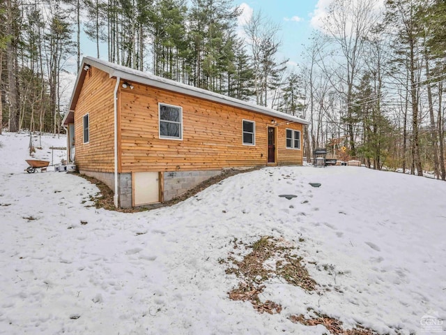 view of snow covered house