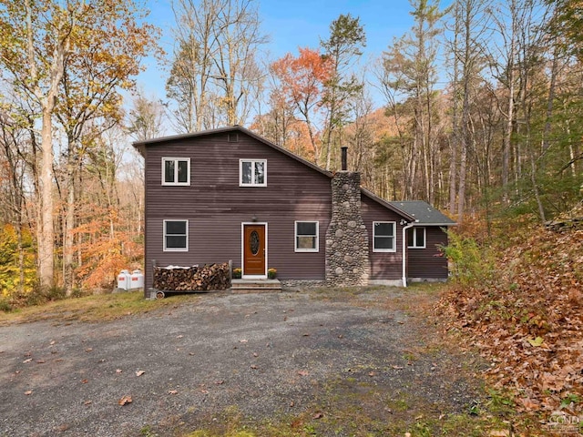 rustic home featuring a chimney