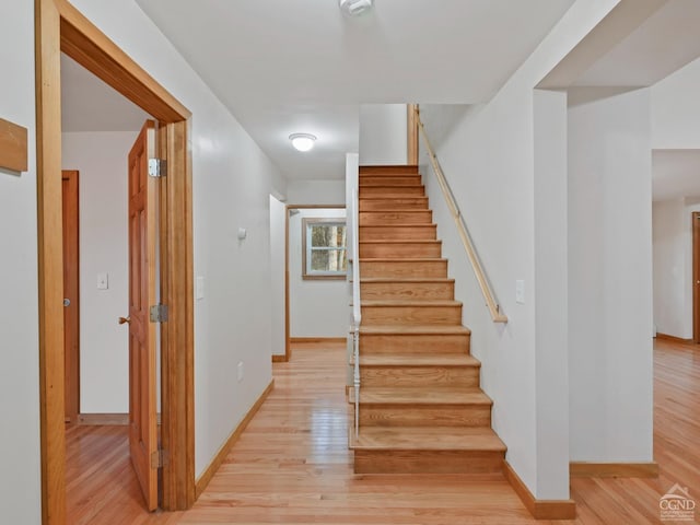 stairway featuring hardwood / wood-style floors