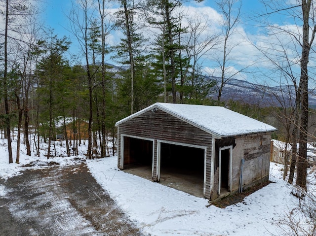 view of snow covered garage