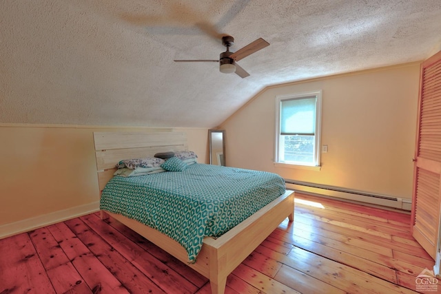 bedroom with a textured ceiling, vaulted ceiling, ceiling fan, a baseboard heating unit, and light hardwood / wood-style flooring