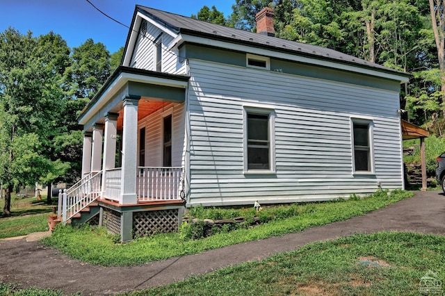 view of home's exterior with a porch