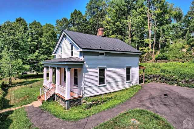 view of home's exterior with covered porch