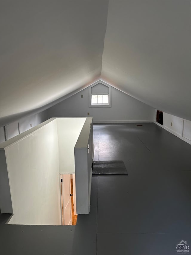 bonus room featuring vaulted ceiling