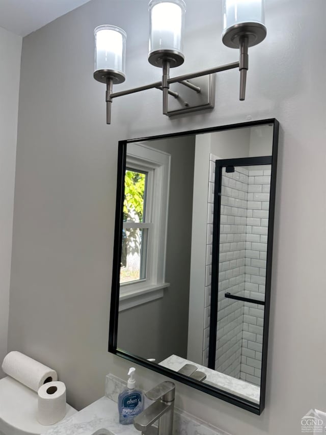 details featuring a shower with shower door