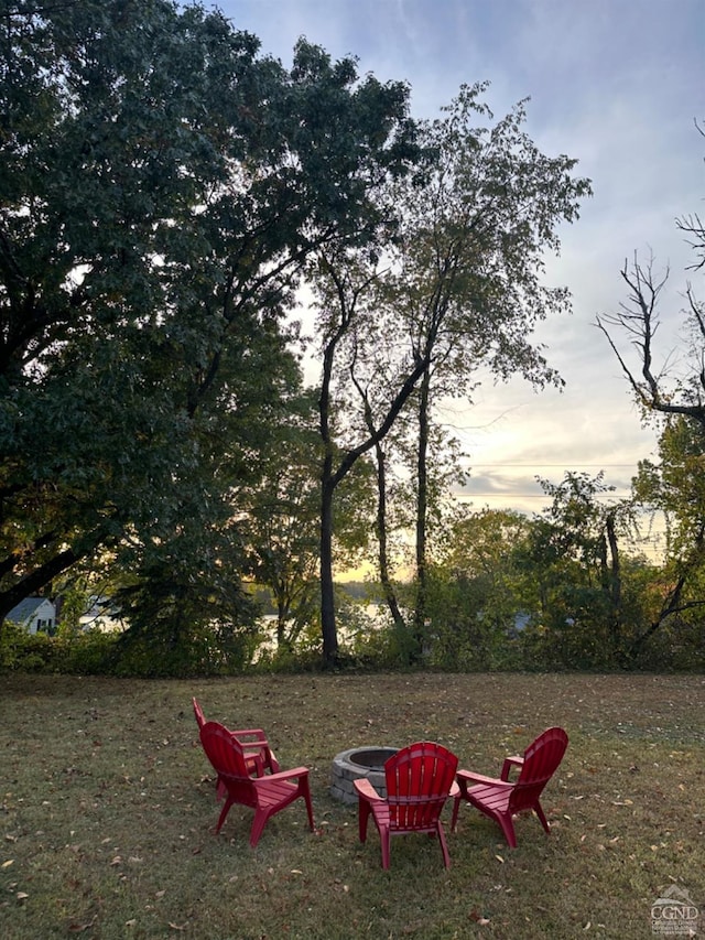 yard at dusk with a fire pit