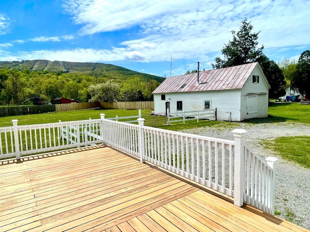 deck with a lawn and a mountain view