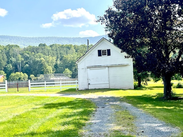 garage featuring a yard